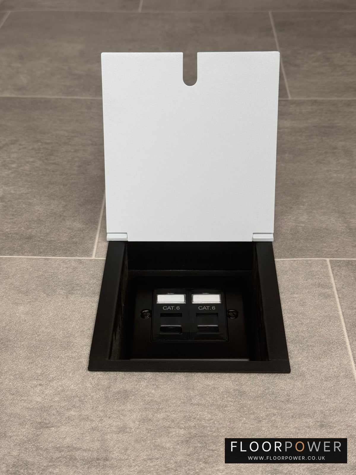 A white recessed floor socket with a double Cat6 RJ45 ethernet socket.