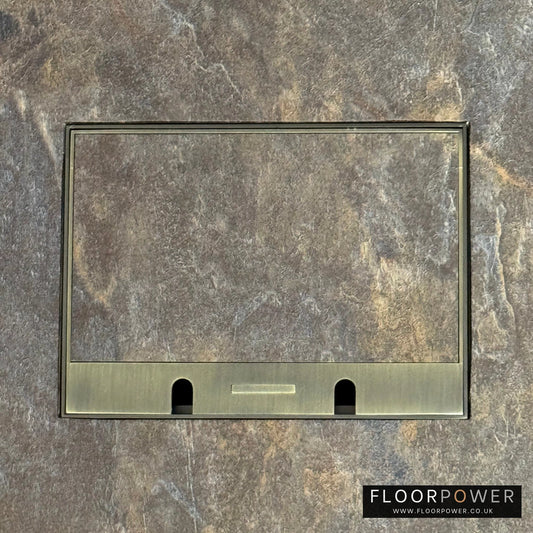 Antique Brass Double Recessed Flush Floor Sockets in a Stone Floor with the stone flooring also inset into the lid.