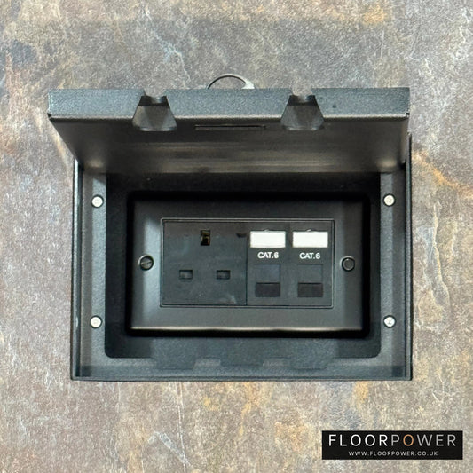 Matt Black Double Recessed Flush Floor Network Combination Socket (13A Plug & 2 x RJ45 sockets) in a stone floor.