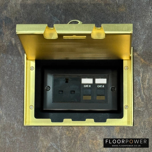 Satin Brass Double Recessed Flush Floor Network Combination Socket (13A Plug & 2 x RJ45 sockets) in a stone floor.