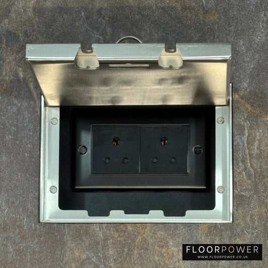Satin Stainless Double Recessed Flush Floor Socket with 5A Round Pin Sockets for Lighting in a stone floor.