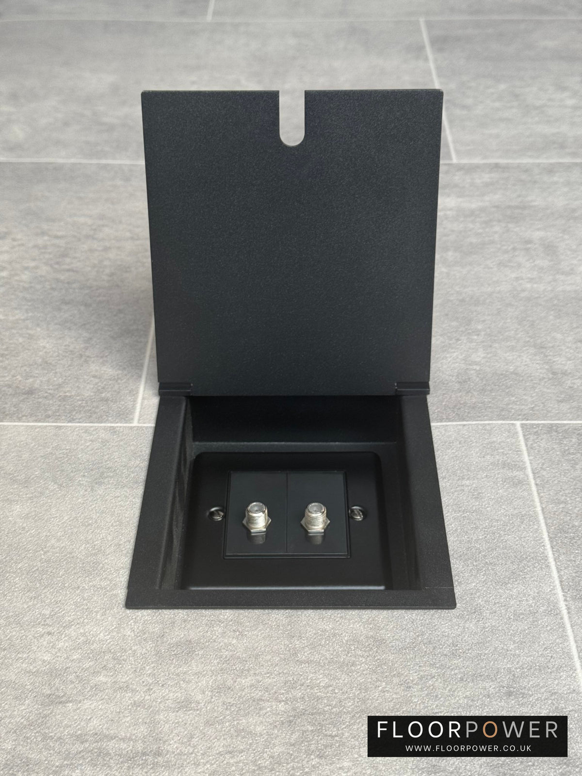 Matt black recessed floor socket with a double satellite socket.
