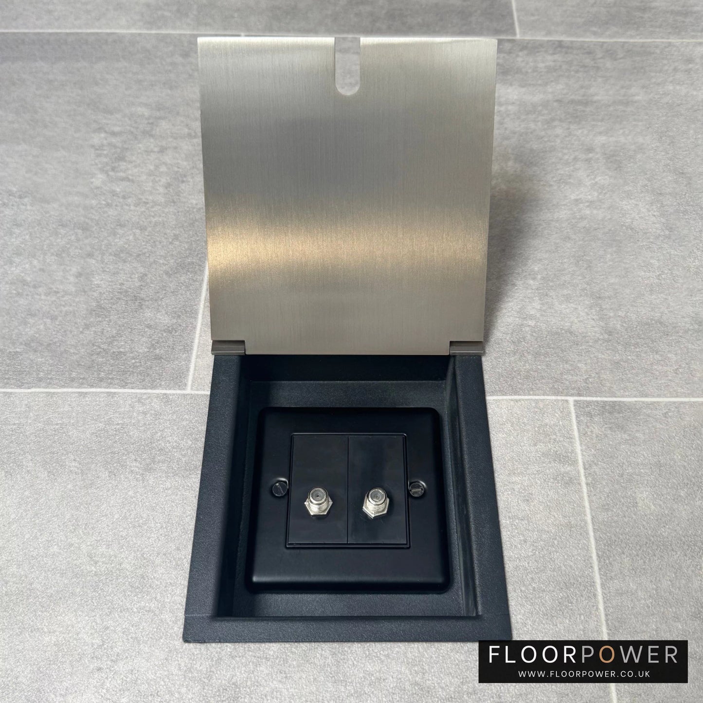 A satin brass recessed floor socket with two satellite F connectors for dual satellite feed.