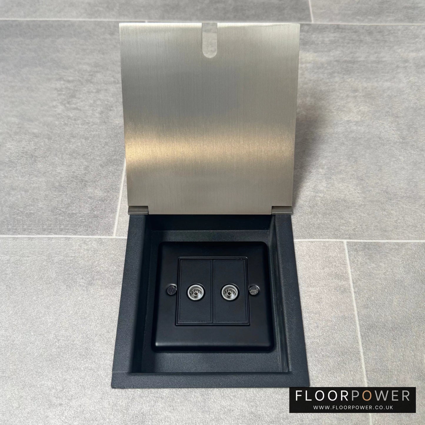 Satin nickel recessed floor socket with an open cover revealing the 2 gang TV socket.