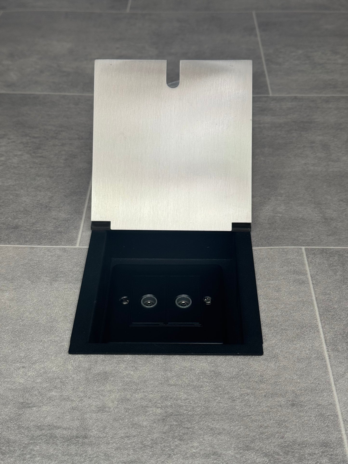 A satin stainless steel recessed floor socket designed for providing dual aerial connectivity with 2 gang TV aerial sockets.