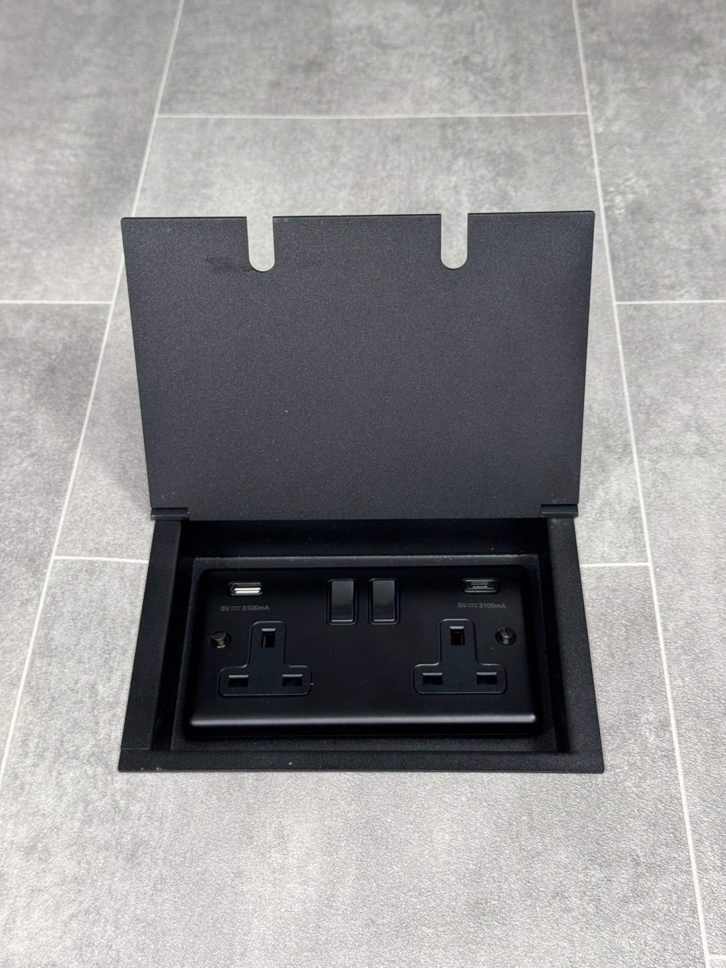 Double recessed floor socket in matt black, featuring a double 13 Amp switched socket with USB C+A charging ports.