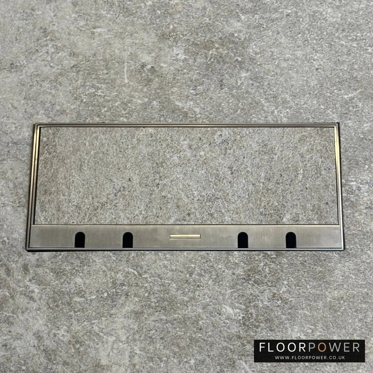 Flush Recessed Floor Socket with Satin Stainless Surround in grey stone floor showing lid closed