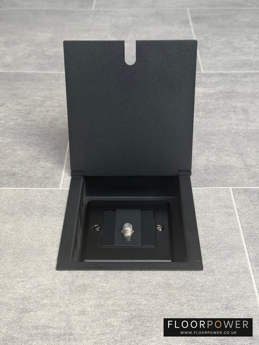 A matt black recessed floor socket with a single gang satellite socket.