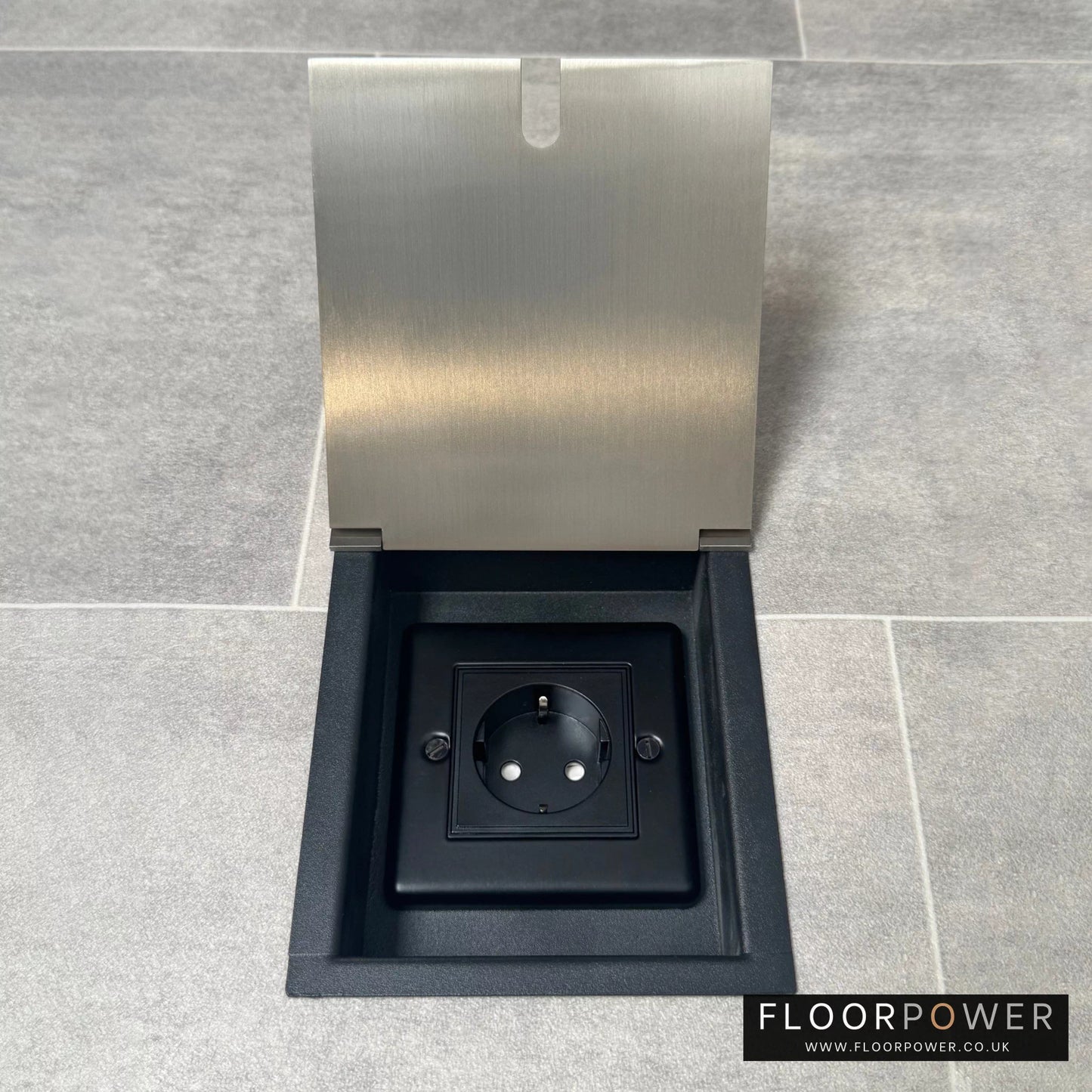 Satin nickel recessed floor socket with a single Schuko (European) plug socket.