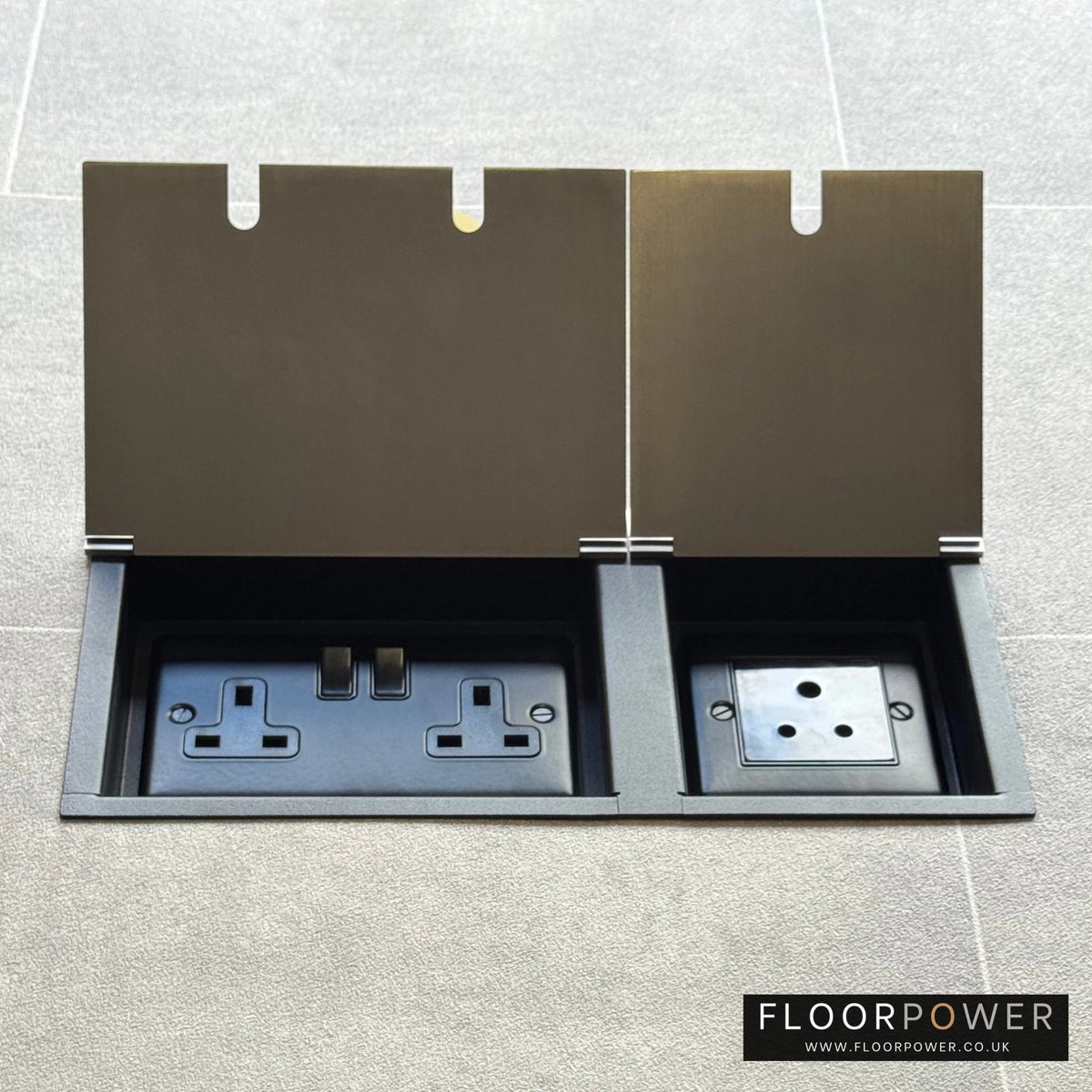 Satin Nickel lighting combination triple floor socket with double 13A switched plug socket and a 5A round pin socket, both lids open.