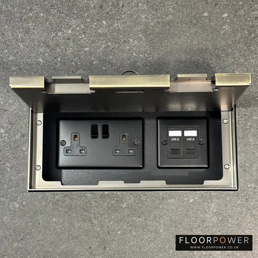 Triple Network Combination Flush Recessed Floor Socket with Antique Brass Surround in grey stone floor