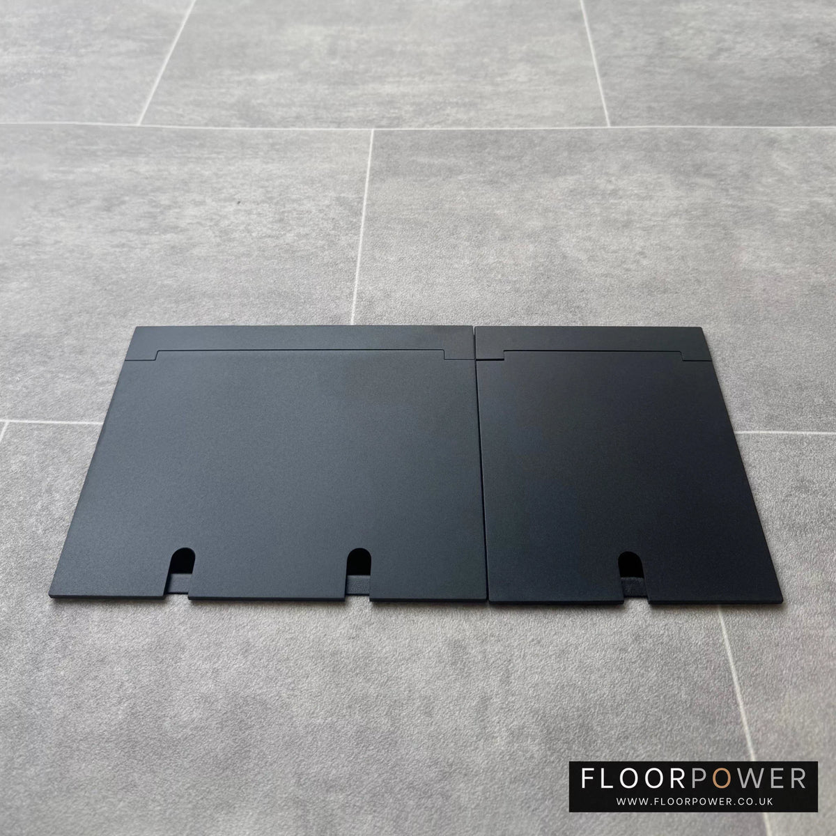 Closed Triple Recessed Floor Socket in Matt Black on tiled floor.