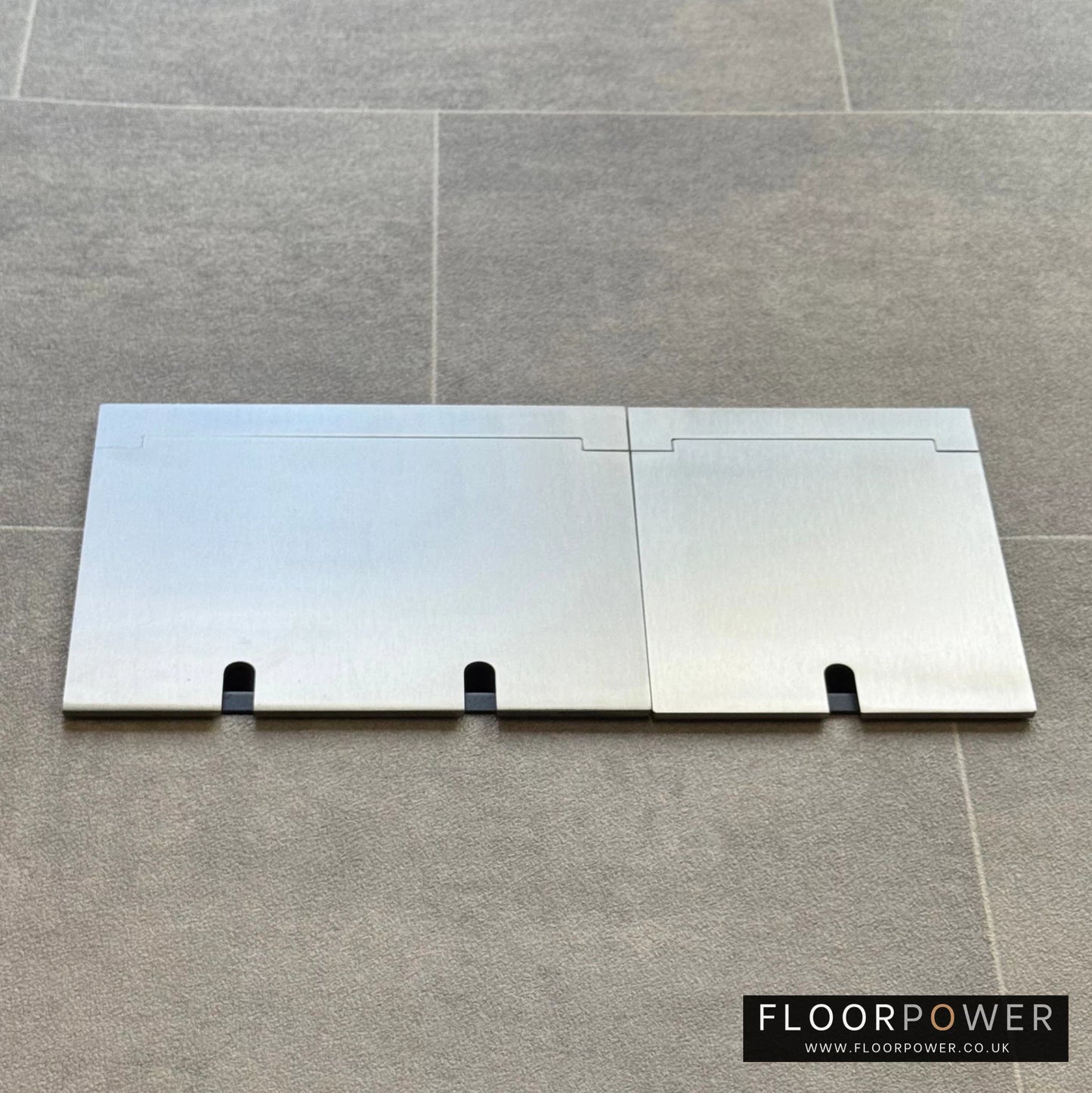 Closed Triple Recessed Floor Socket in Satin Nickel on tiled floor.