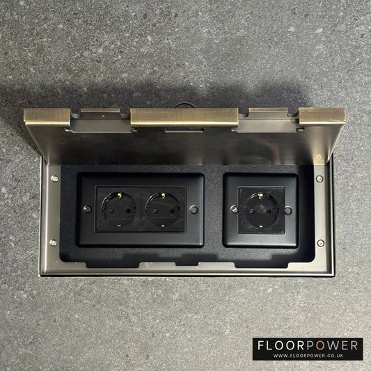 Triple Schuko (European) Plug Socket Flush Recessed Floor Socket with Antique Brass surround in grey stone floor
