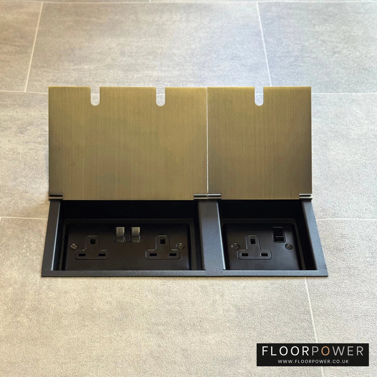 Antique Brass lighting combination triple floor socket with double 13A switched plug socket and a 5A round pin socket, both lids open.
