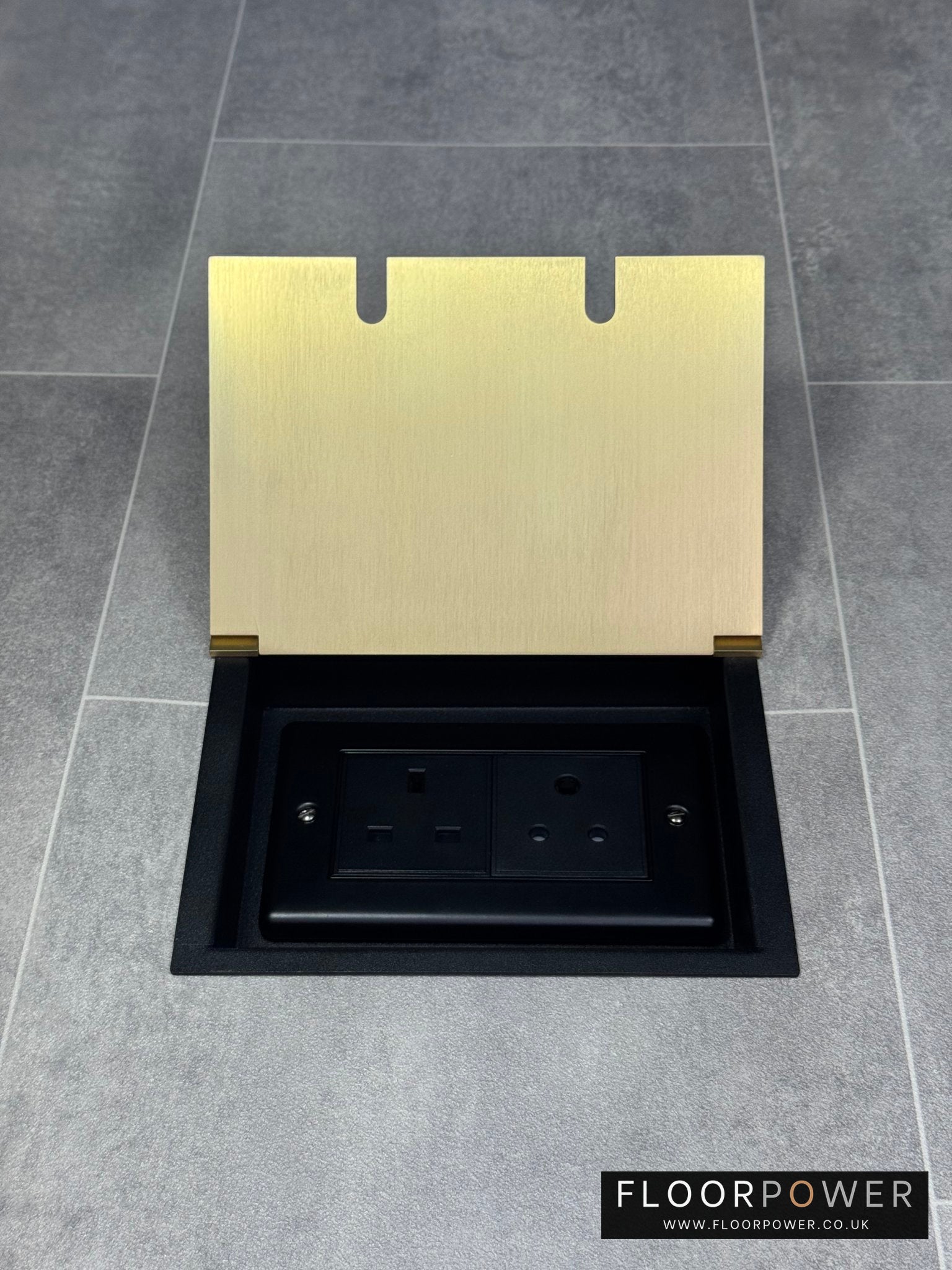Recessed floor socket double box in satin brass with one 13 amp and one 5 amp unswitched socket.