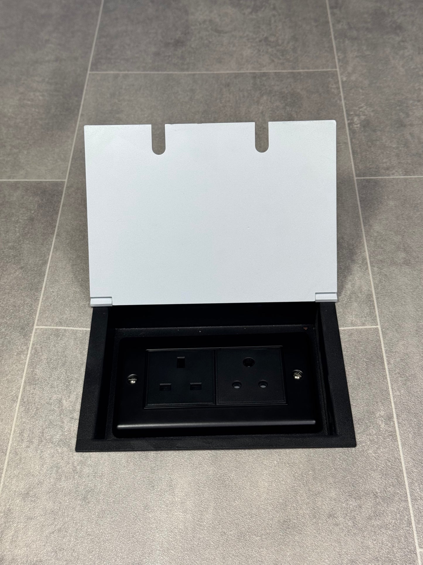 Recessed floor socket double box in white with one 13 amp and one 5 amp unswitched socket.