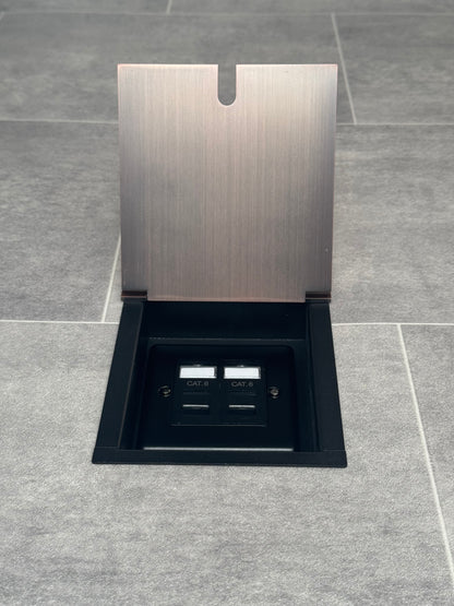 Recessed floor socket with antique copper finish and a 2 gang Cat6 RJ45 Ethernet socket.