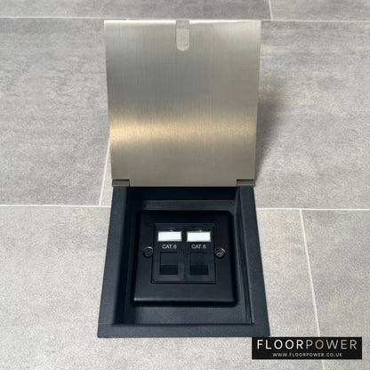 A recessed floor socket with a satin nickel cover, two RJ45 sockets, designed for network cable management.