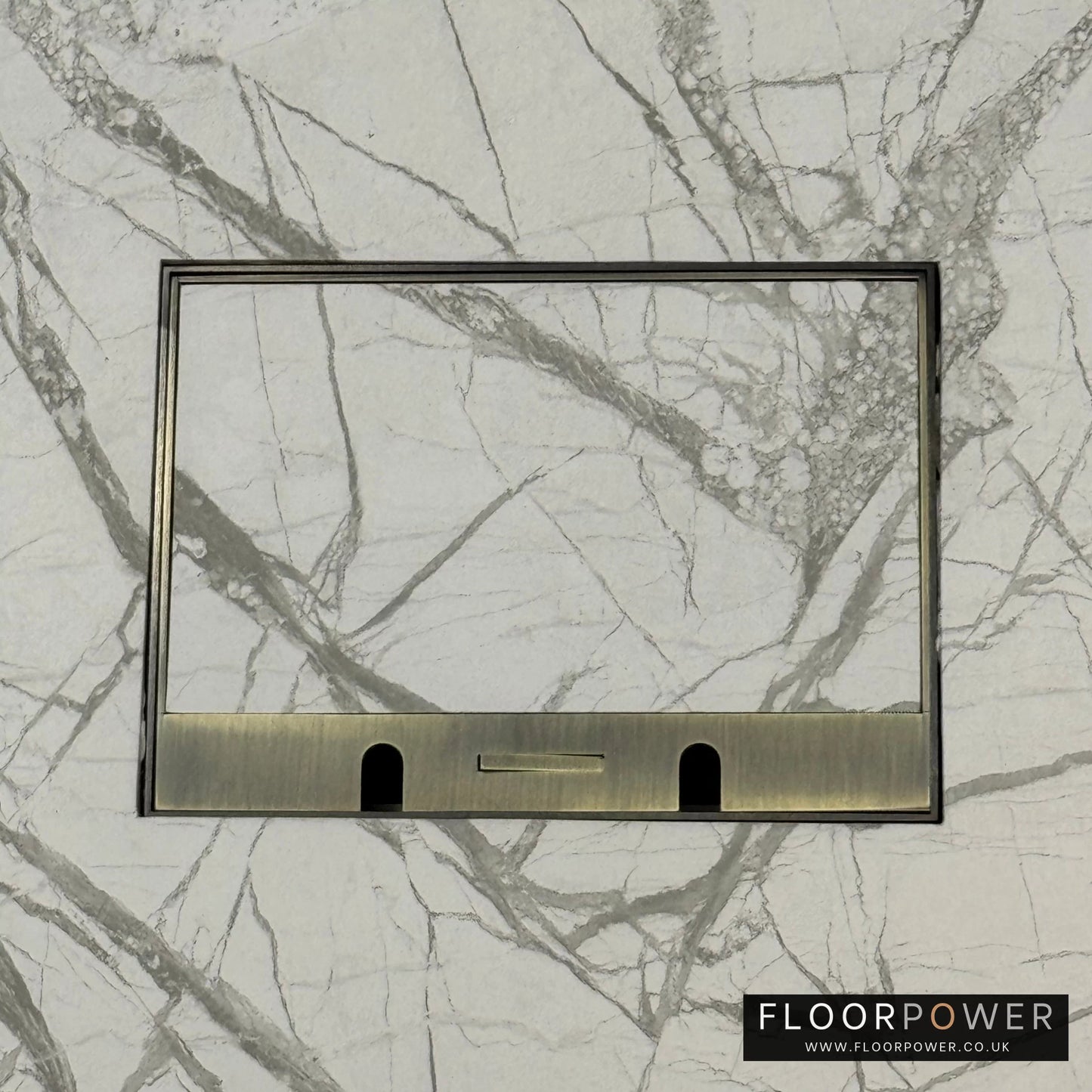 Antique Brass Double Recessed Flush Floor Sockets in a Marble Floor with the marble also inset into the lid.