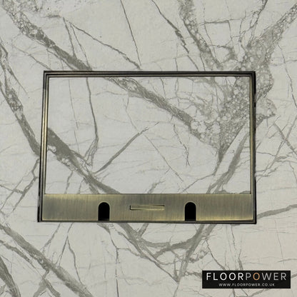 Antique Brass Double Recessed Flush Floor Sockets in a Marble Floor with the marble also inset into the lid.