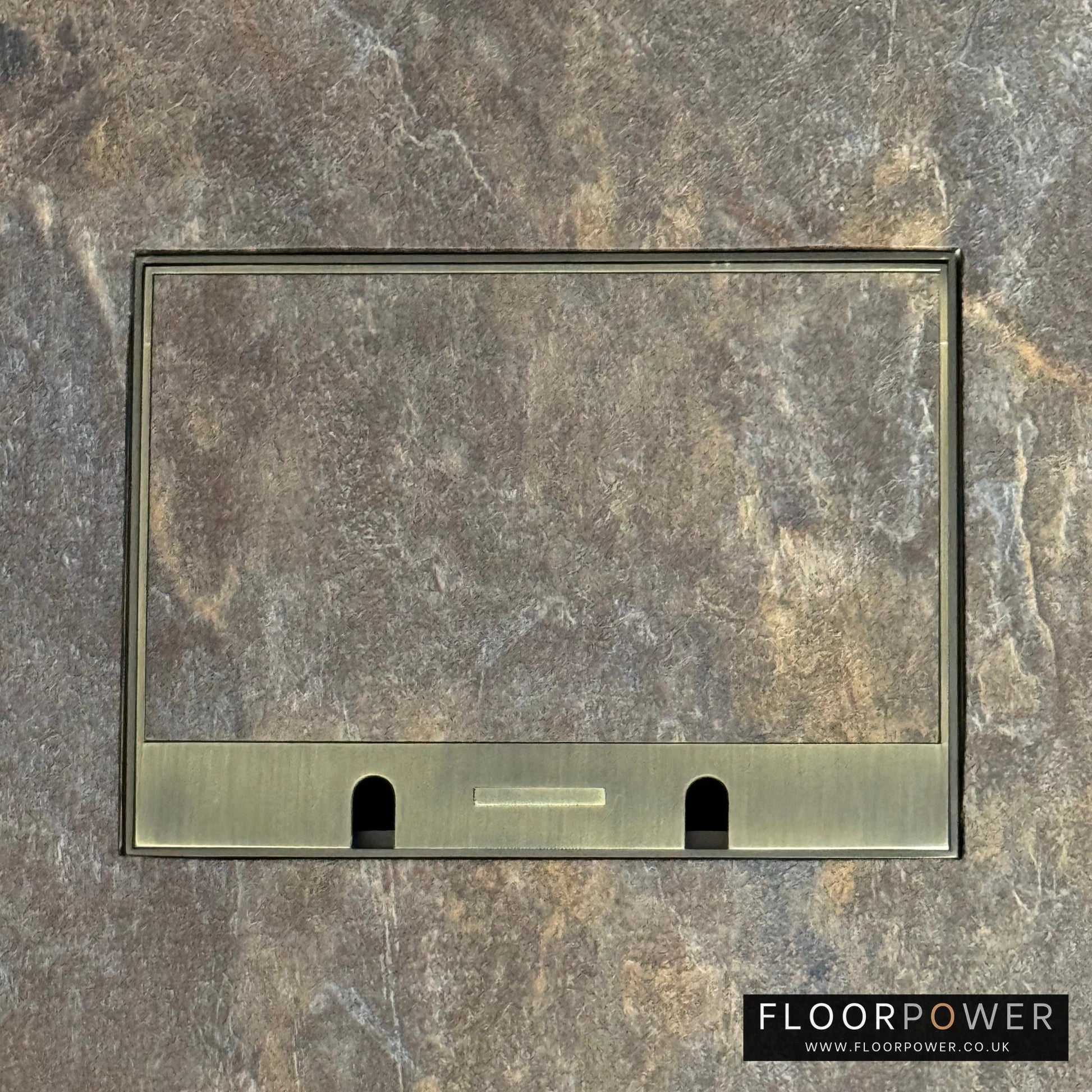 Antique Brass Double Recessed Flush Floor Sockets in a Stone Floor with the stone flooring also inset into the lid.