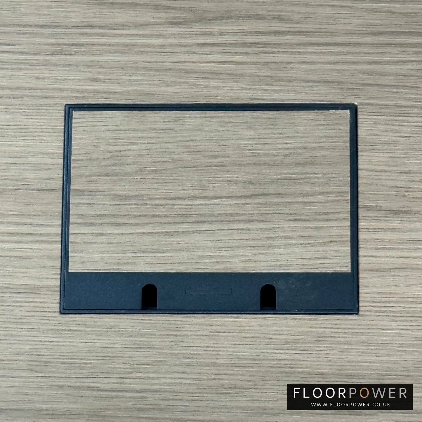 Matt Black Double Recessed Flush Floor Sockets in a Light Wood Floor with the wood flooring also inset into the lid.