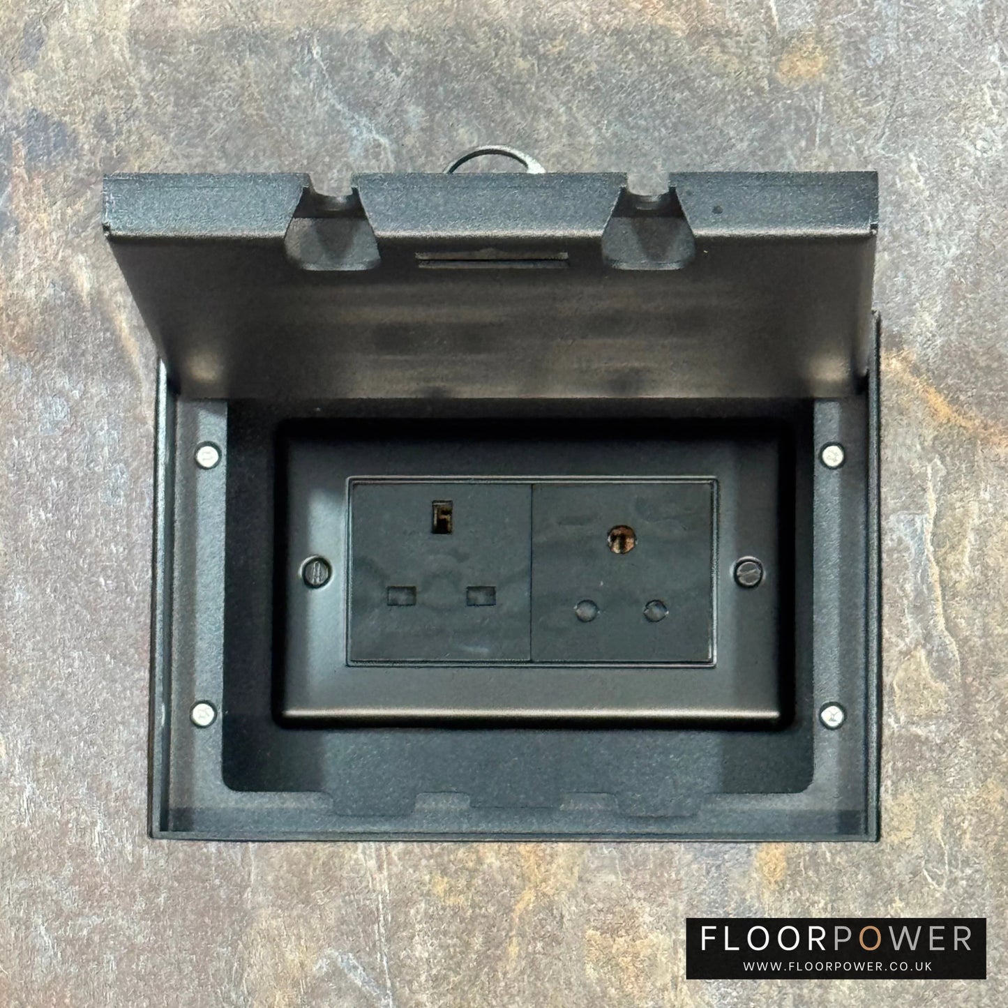 Matt Black Double Recessed Flush Floor Lighting Combination Socket (13A & 5A Round Pin Plug Sockets) in a stone floor.