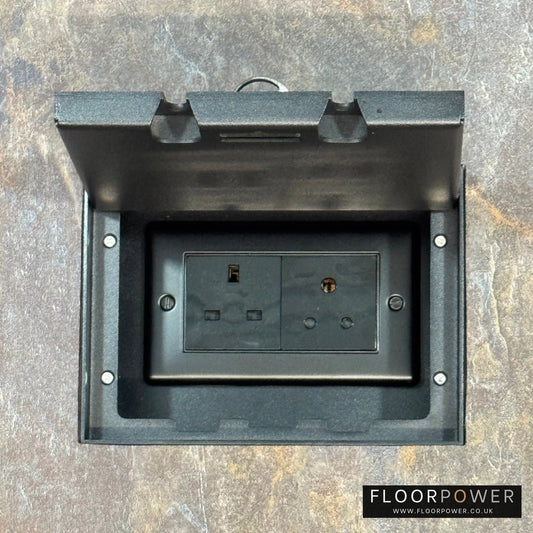 Matt Black Double Recessed Flush Floor Lighting Combination Socket (13A & 5A Round Pin Plug Sockets) in a stone floor.