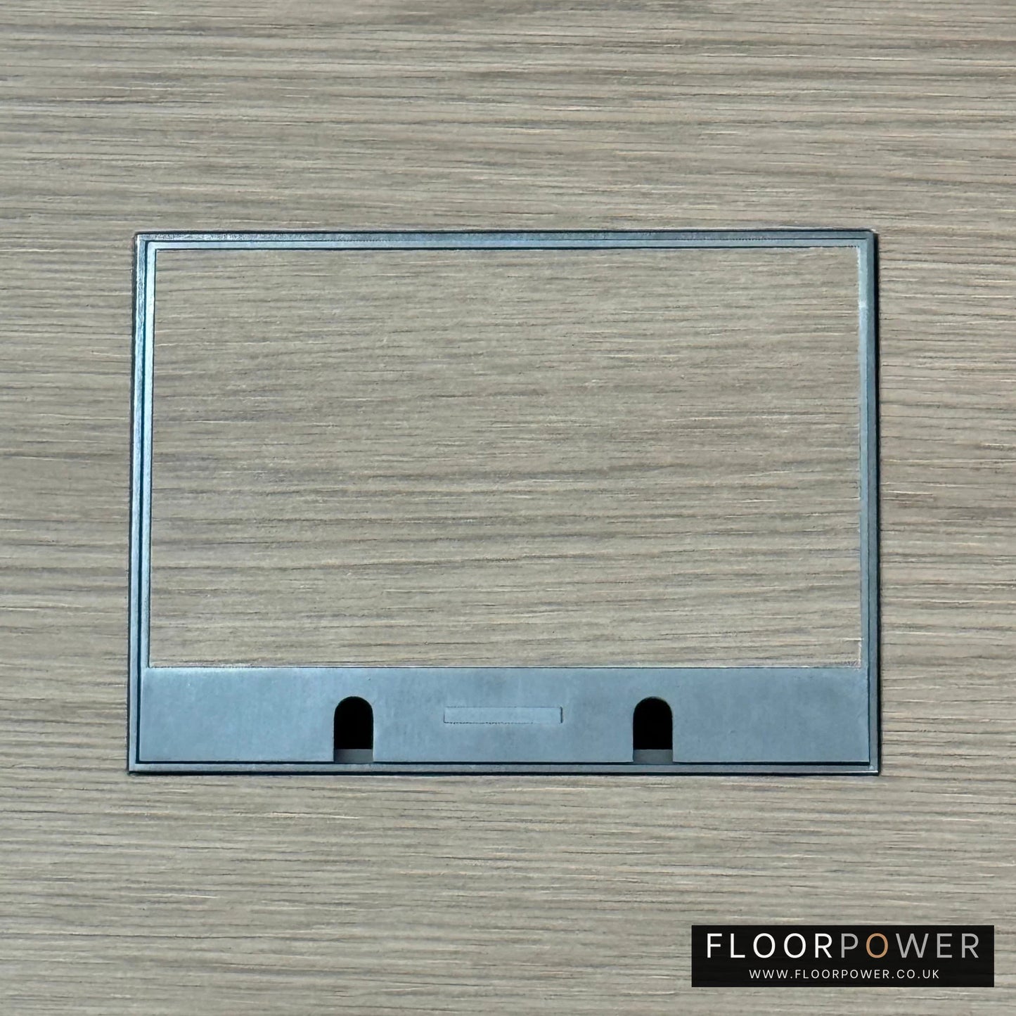 Old Bronze Double Recessed Flush Floor Sockets in a Light Wood Floor with the wood flooring also inset into the lid.