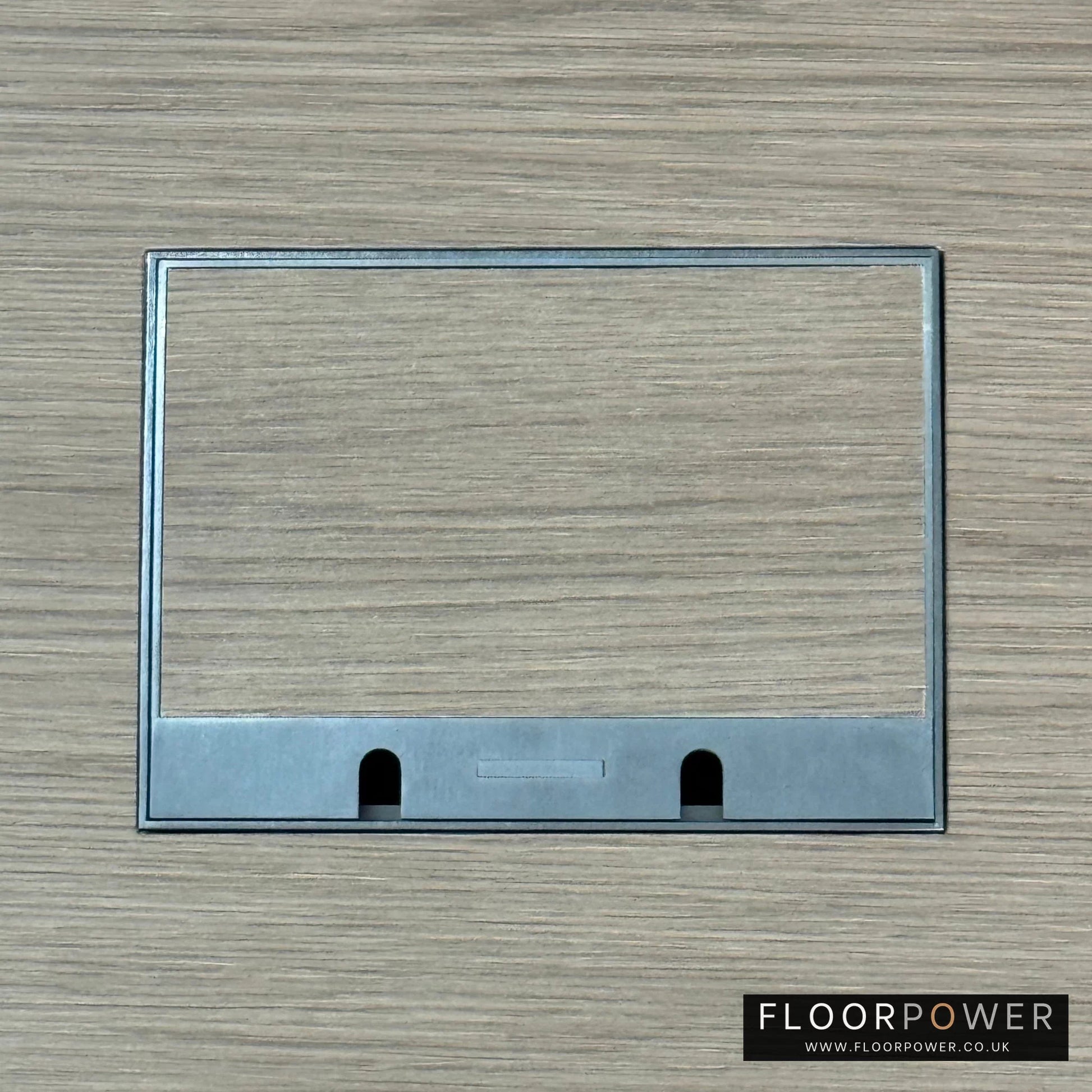 Old Bronze Double Recessed Flush Floor Sockets in a Light Wood Floor with the wood flooring also inset into the lid.