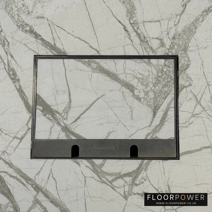 Old Bronze Double Recessed Flush Floor Sockets in a Marble Floor with the marble also inset into the lid.