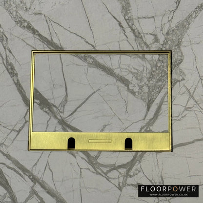 Satin Brass Double Recessed Flush Floor Sockets in a Marble Floor with the marble also inset into the lid.