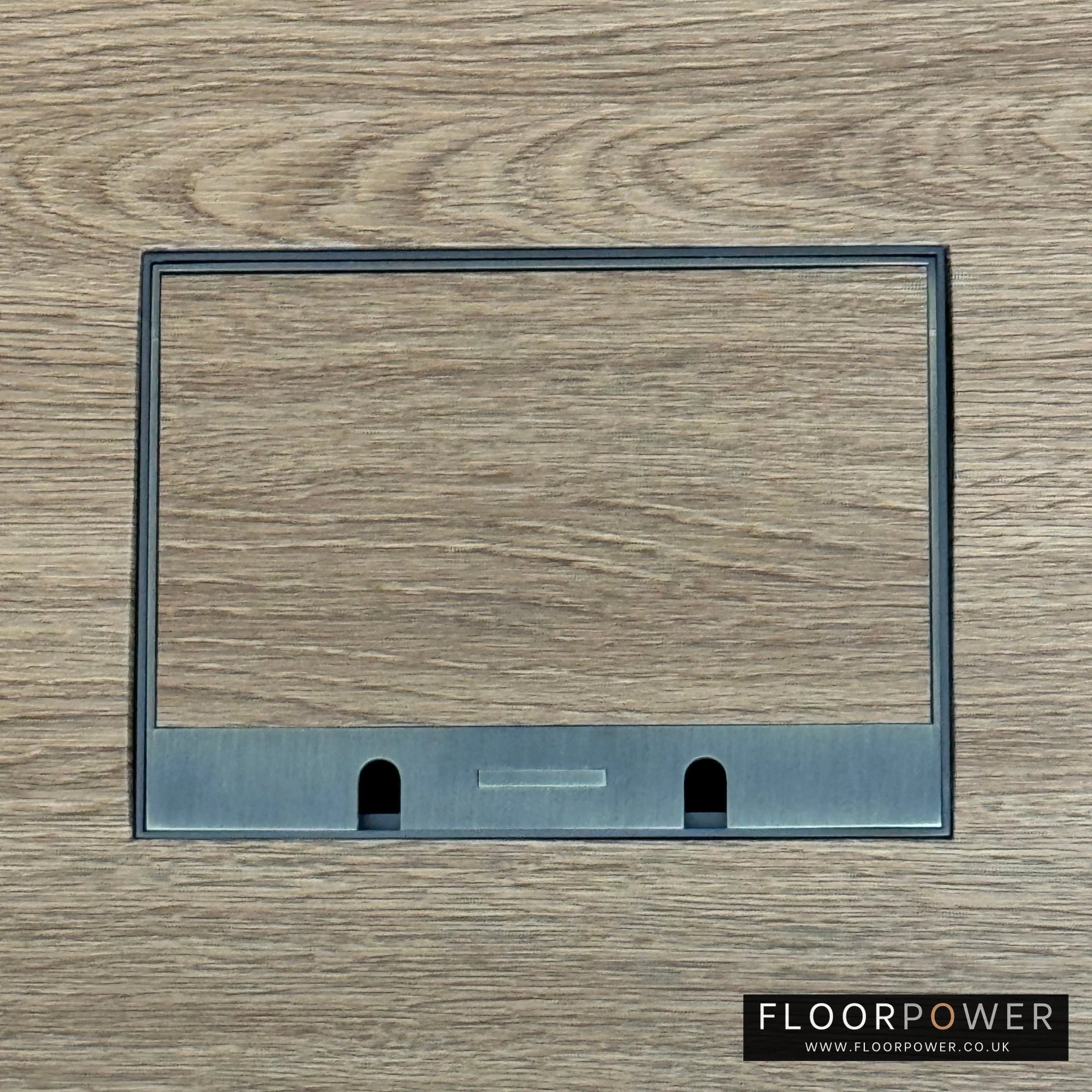 Satin Brass Double Recessed Flush Floor Sockets in an Oak Floor with oak flooring also inset into the lid.