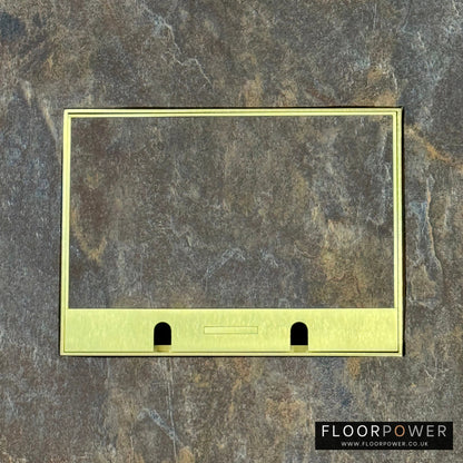 Satin Brass Double Recessed Flush Floor Sockets in a Stone Floor with the stone flooring also inset into the lid.
