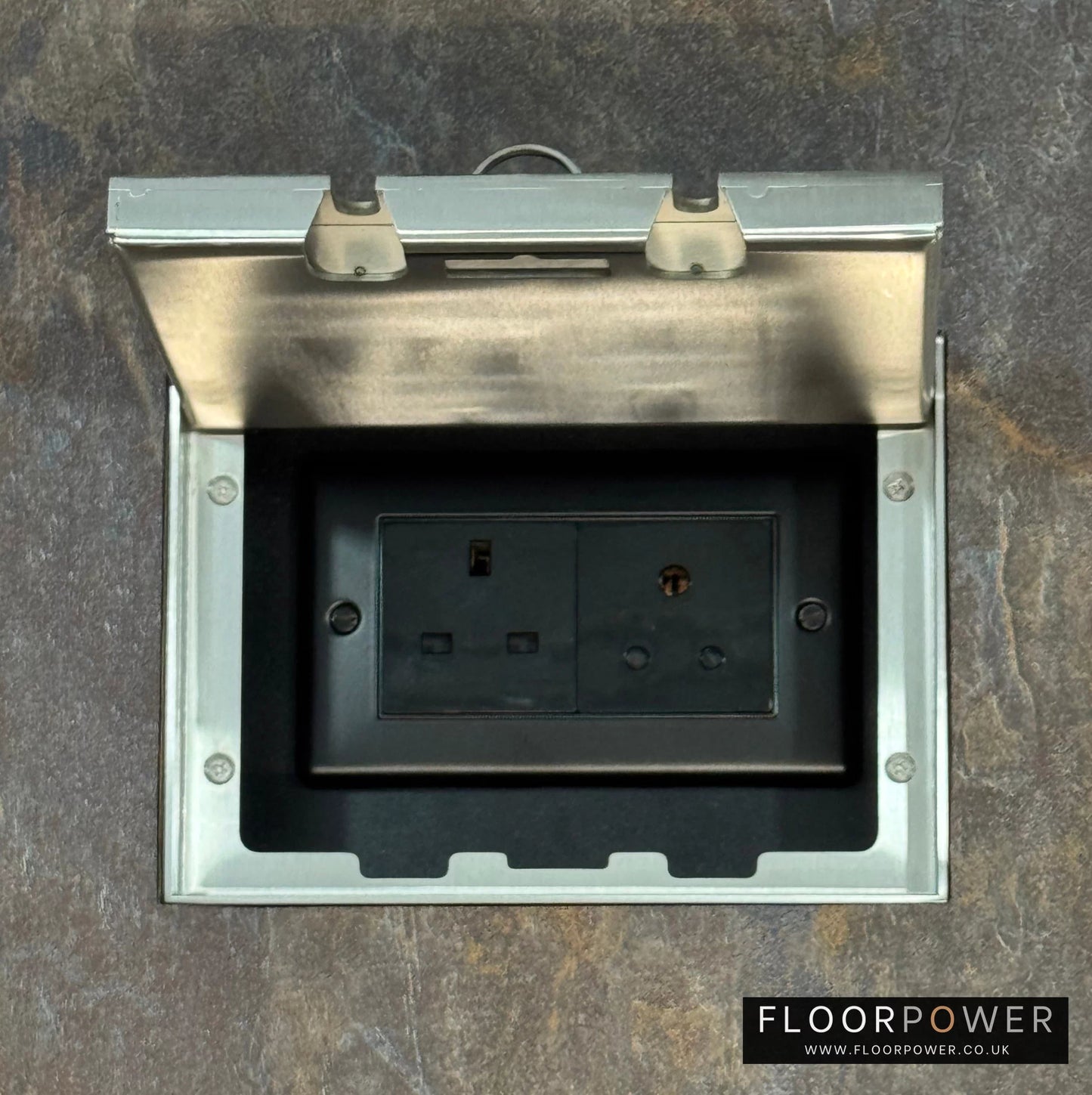 Satin Stainless Double Recessed Flush Floor Lighting Combination Socket (13A & 5A Round Pin Plug Sockets) in a stone floor.