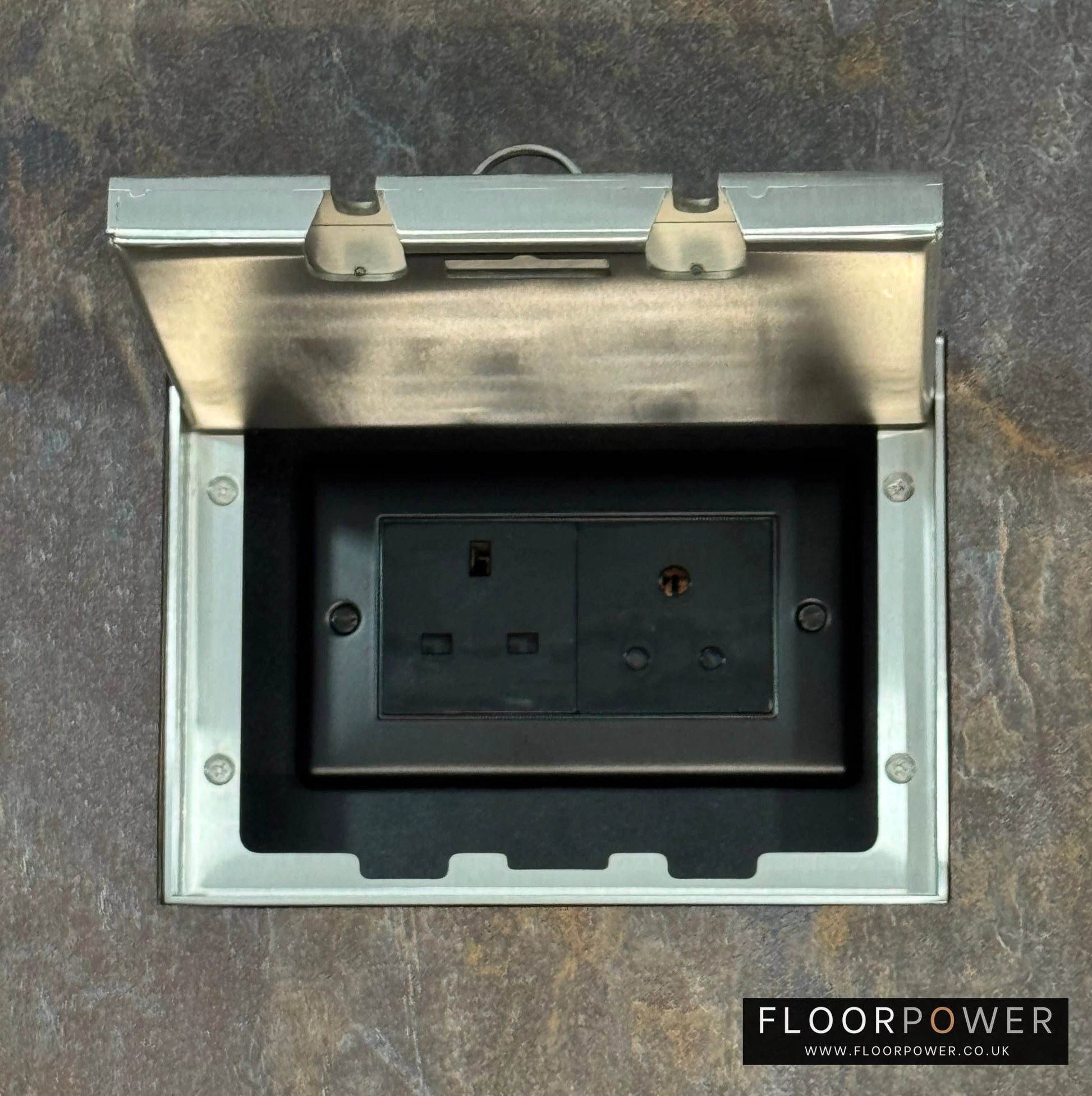 Satin Stainless Double Recessed Flush Floor Lighting Combination Socket (13A & 5A Round Pin Plug Sockets) in a stone floor.