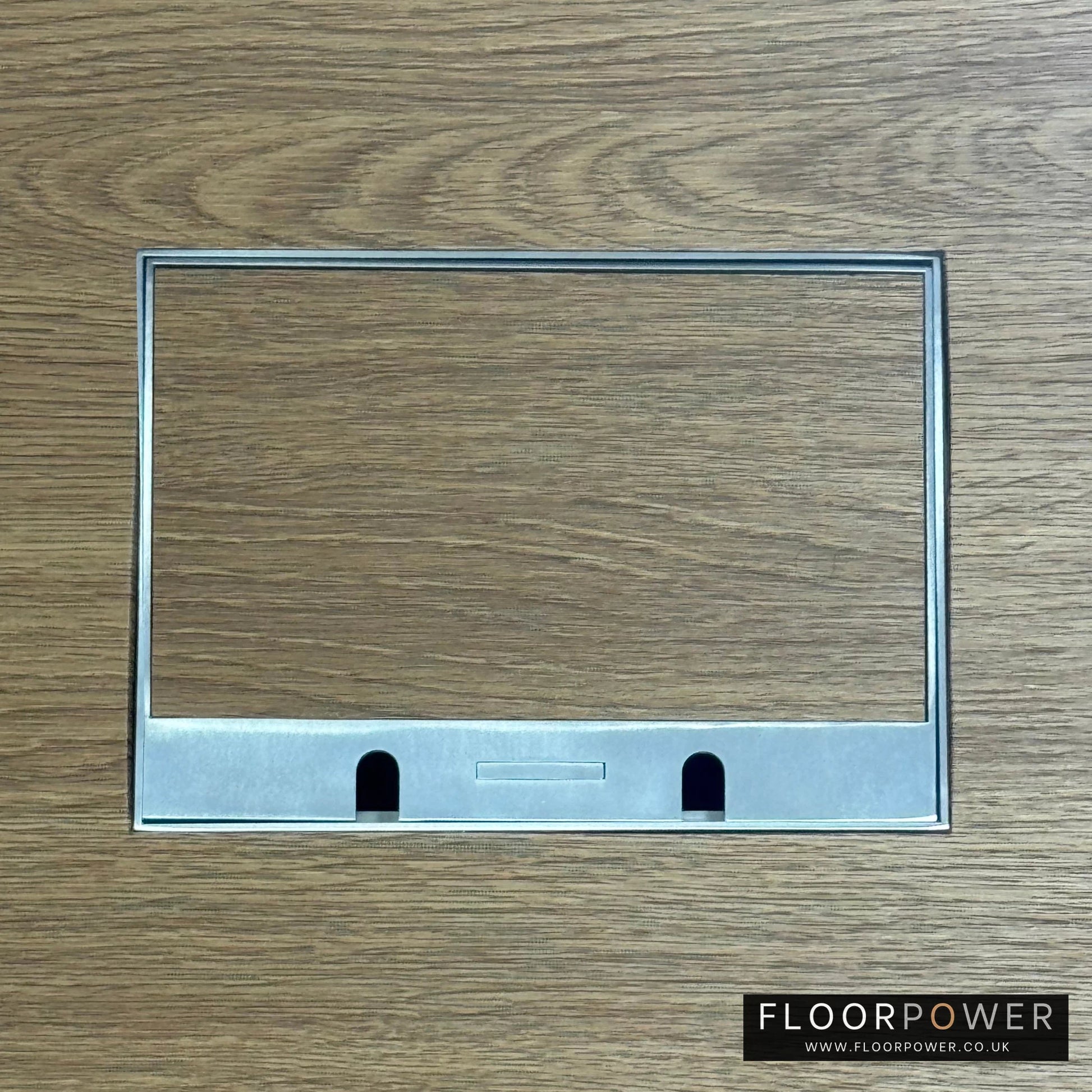 Satin Stainless Double Recessed Flush Floor Sockets in an Oak Floor with oak flooring also inset into the lid.