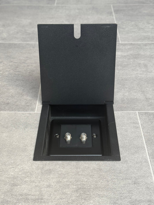 Matt black recessed floor socket with a double satellite socket.