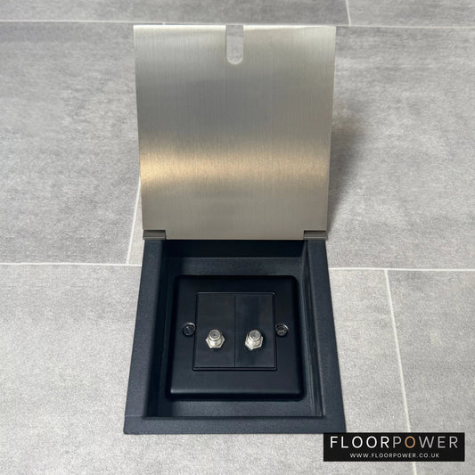 A satin brass recessed floor socket with two satellite F connectors for dual satellite feed.