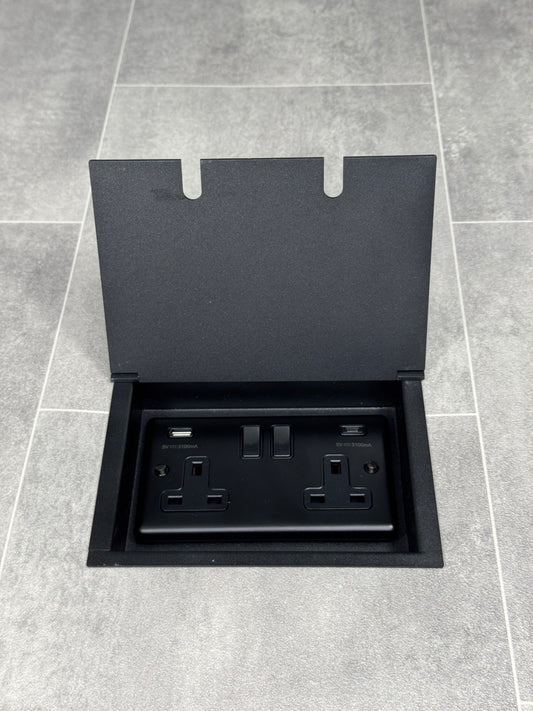 Double recessed floor socket in matt black, featuring a double 13 Amp switched socket with USB C+A charging ports.