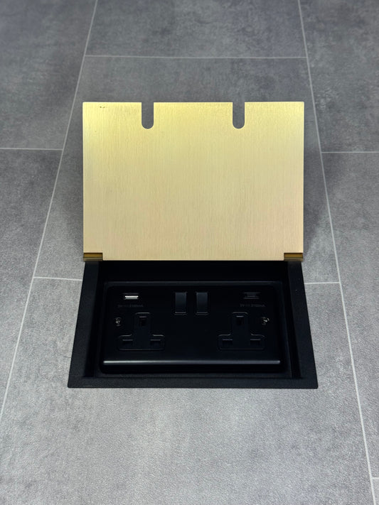 Double recessed floor socket in satin brass, featuring a double 13 Amp switched socket with USB C+A charging ports.
