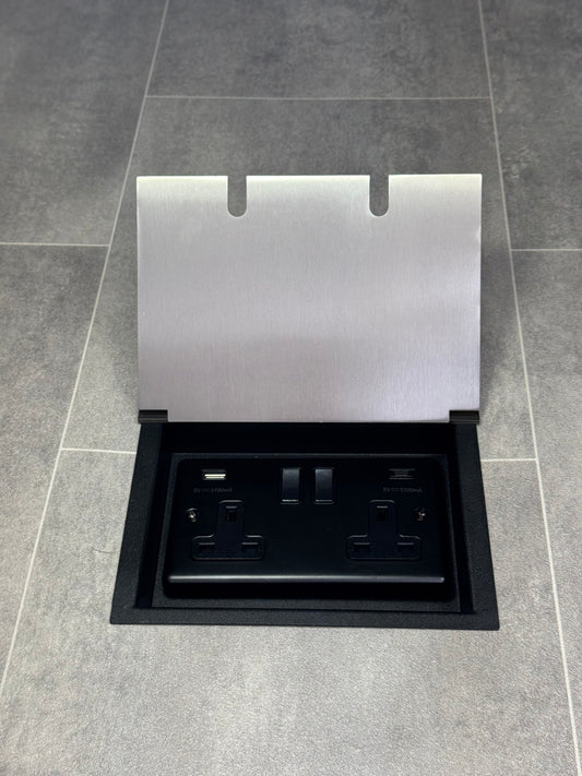 A satin stainless steel double recessed floor socket with a 13 amp switched socket and USB A+C ports.