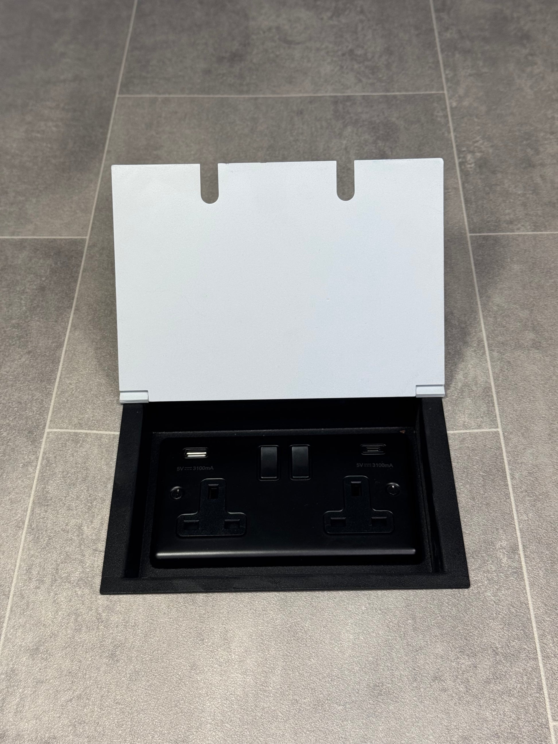A white double recessed floor socket featuring a double 13 Amp switched socket with USB C+A charging ports.