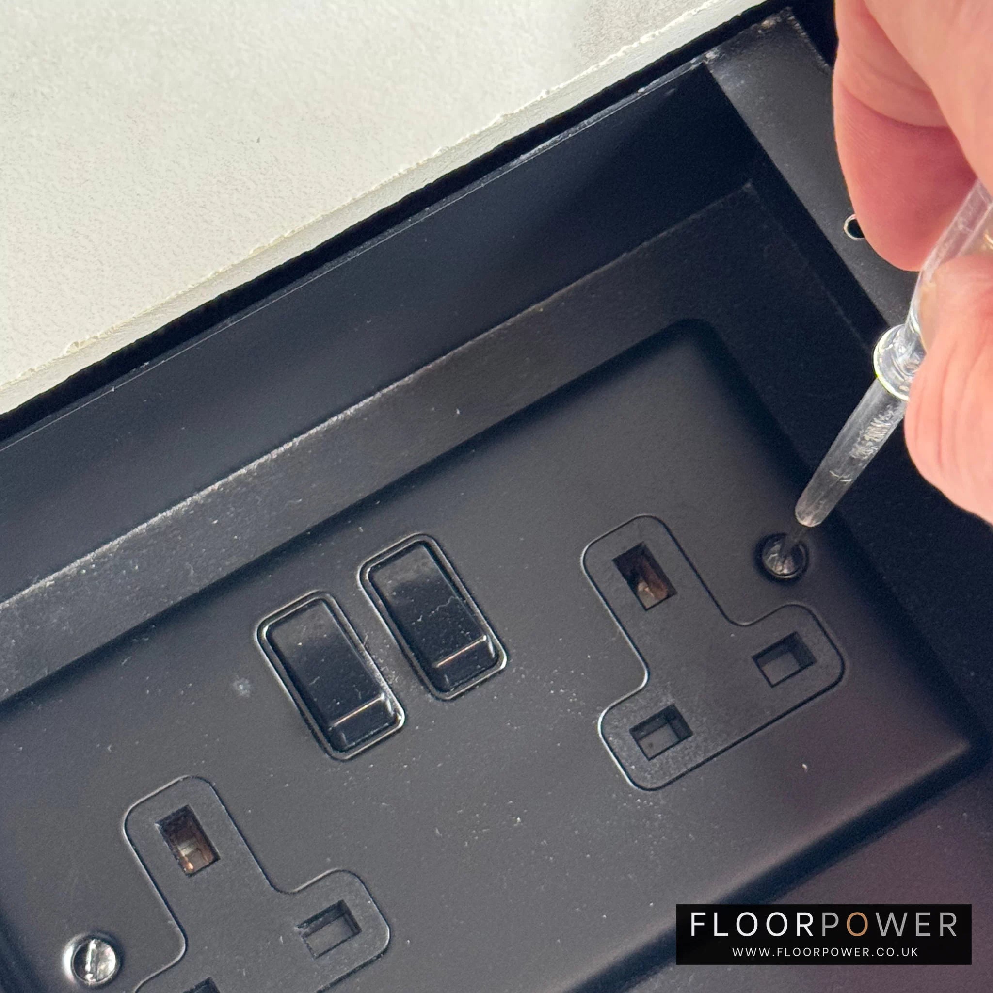 Wiring up the socket and securing in place.