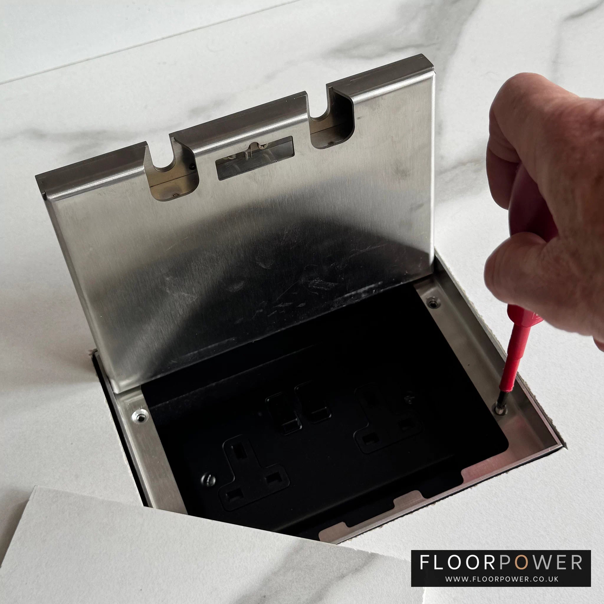 Attaching the inlay lid to the recessed socket body.