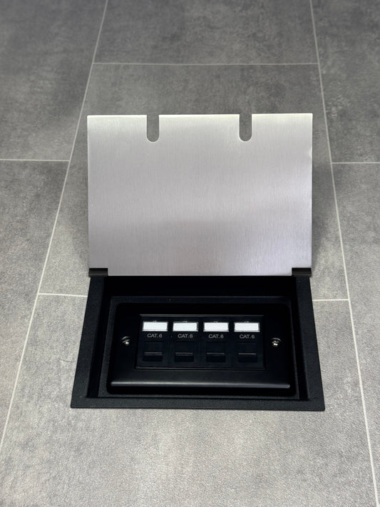 A satin stainless steel double recessed floor socket with a 4 gang RJ45 Cat6 socket, set against a grey tiled floor.