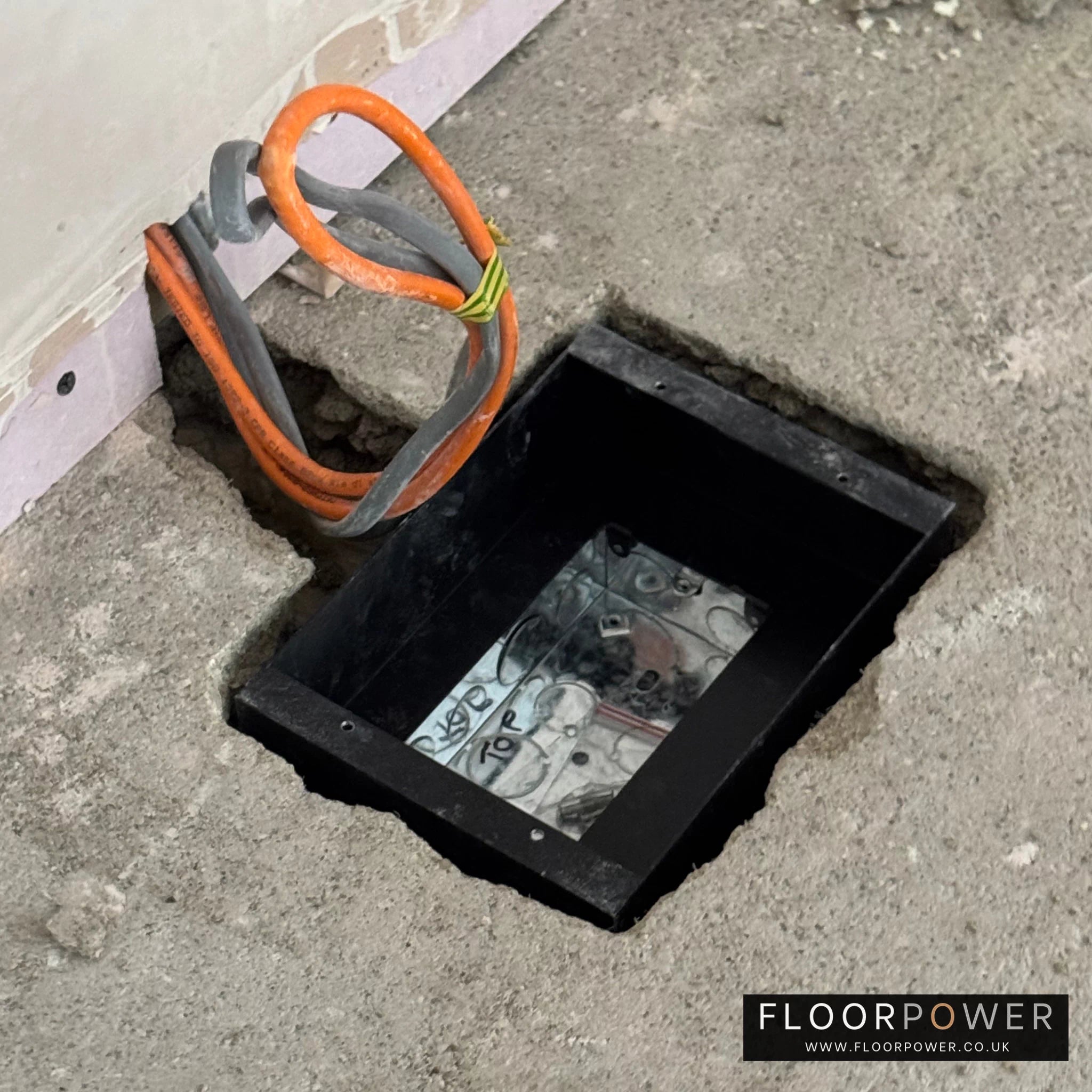 Installing a recessed floor socket, place the recessed floor socket body into the hole.