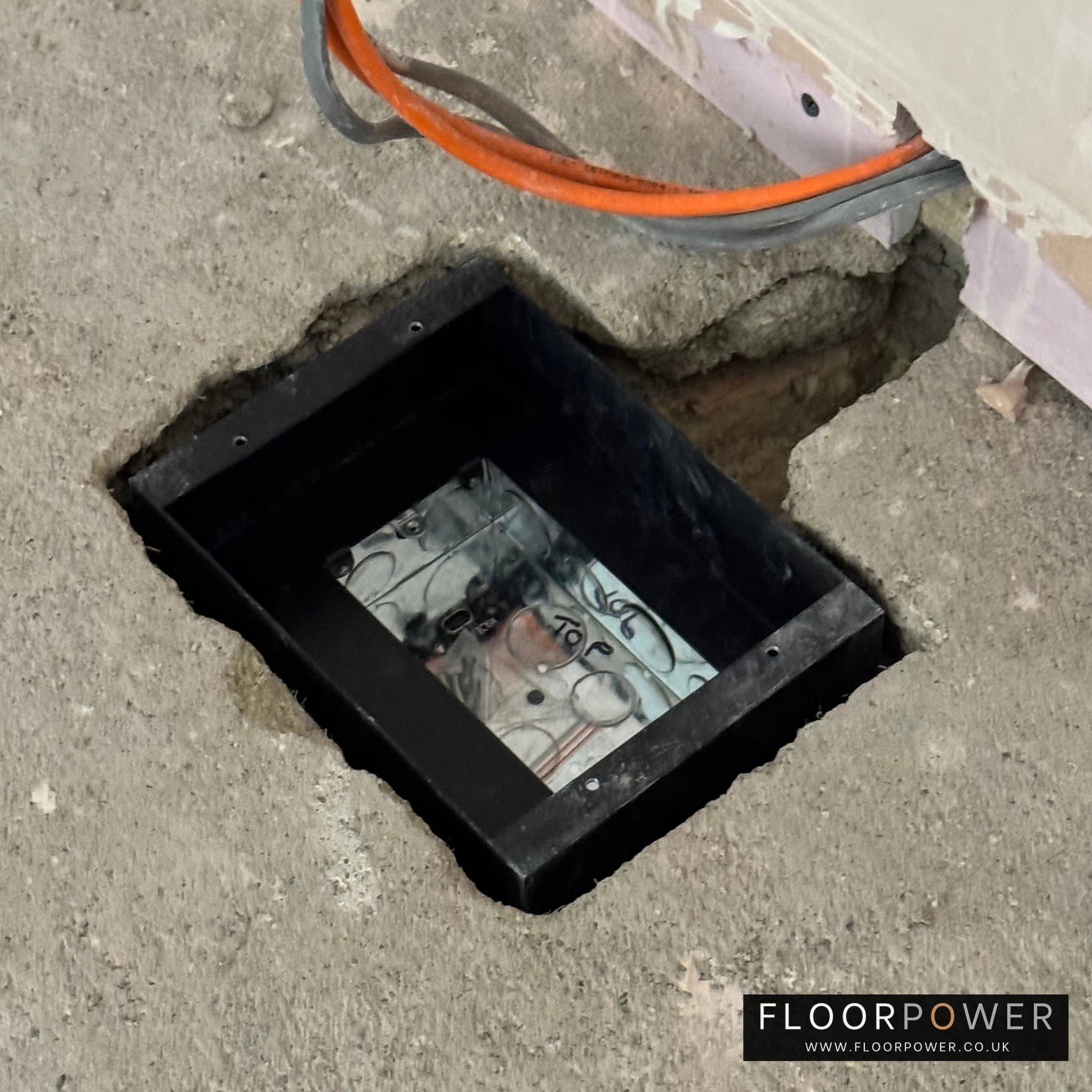 Installing a recessed floor socket, place the recessed floor socket body into the hole.