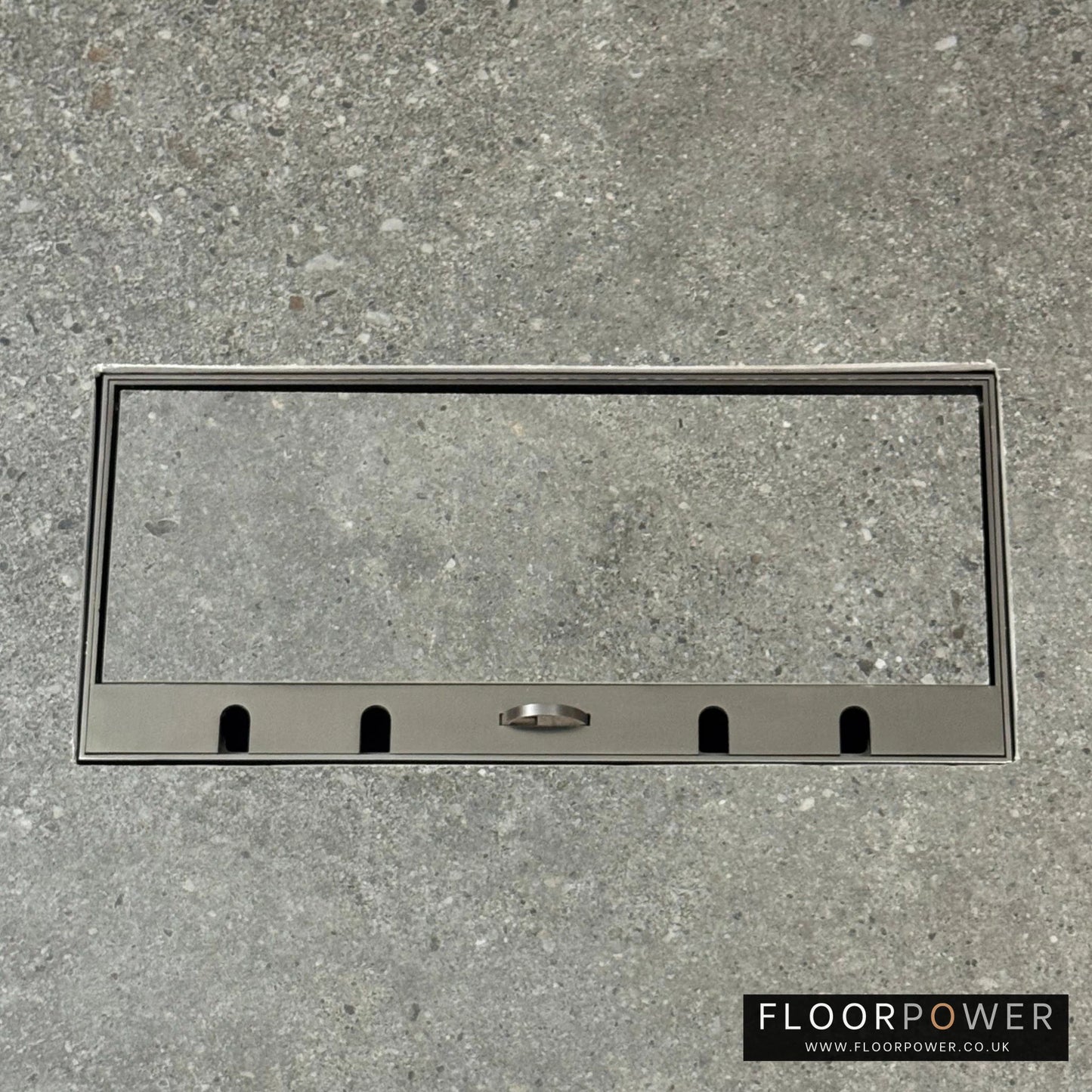 Flush Recessed Floor Socket with Old Bronze Surround in grey stone floor showing the lid handle in the up position